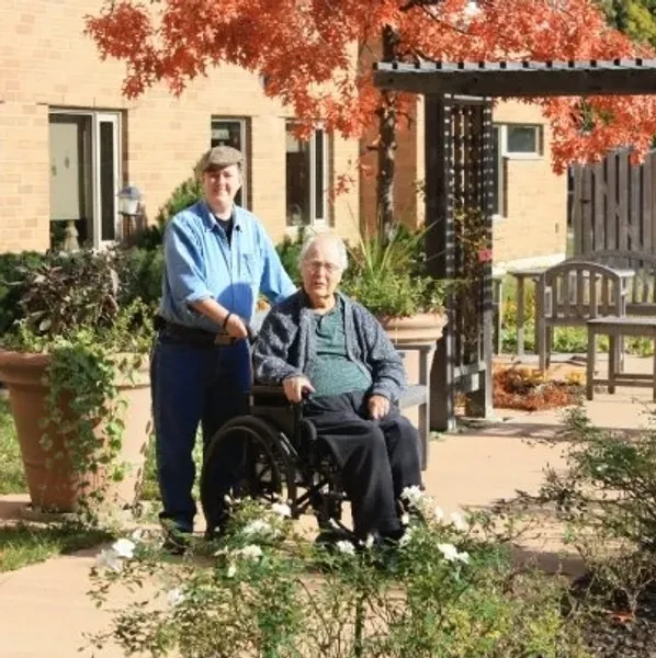 Dad with caregiver in garden before the Ergotrans